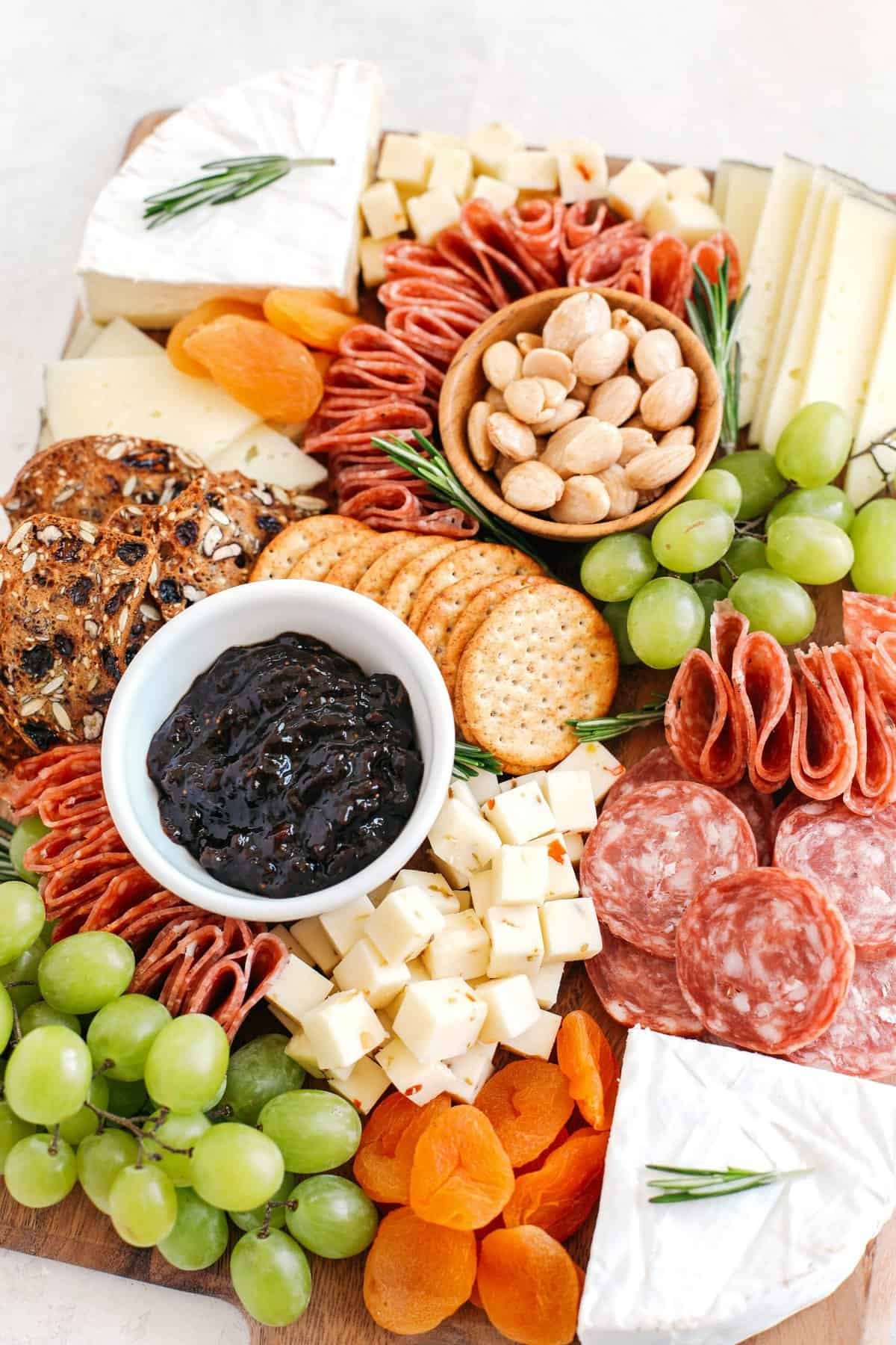 Artisanal cheeseboard with variety of meats and fruits